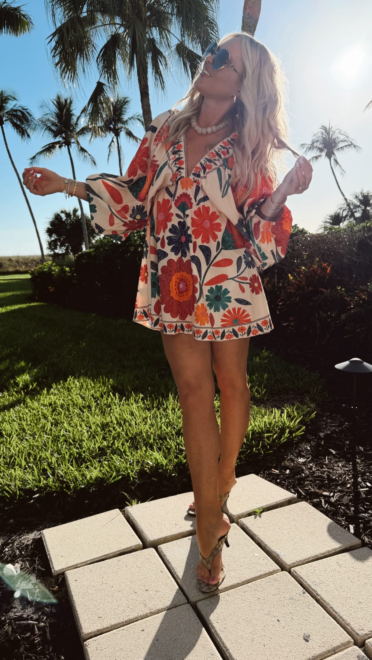 this baby climbed to the top of the store front✨🔥- it’s giving farm rio without the price & it has been a big hit! 
CommenT: DRESS for a DM to shop or head to my bio! 

More prints- I did small. Have a great weekend! Soaking up all the sun, sand and family time here for a few days 🐚🤍☀️!

dress, resort wear, spring dress, women’s fashion, spring outfits, sandals, weekend, Gucci, Amazon fashion, looks for less, colorful dress, spring outfits, beach, bday outfit, necklace, spring 2026, outfit ideas, short dress,